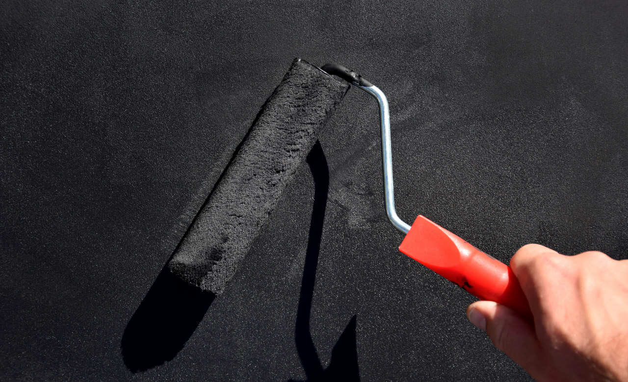 Application of bitumen on shed roof for waterproofing